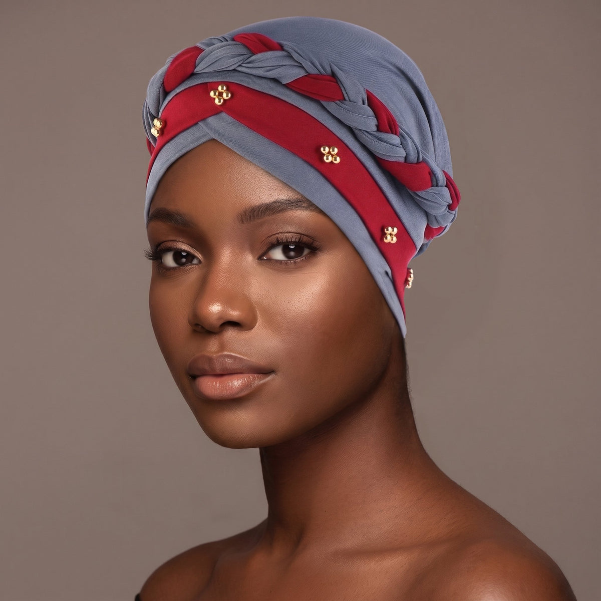 Woman wearing the grey and red three-layer twist turban