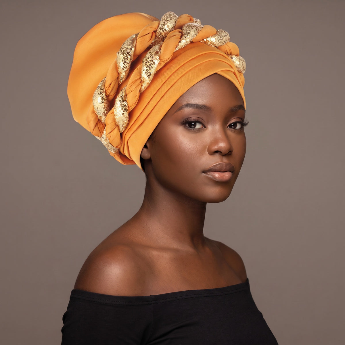 Woman wearing the yellow sequin braided turban