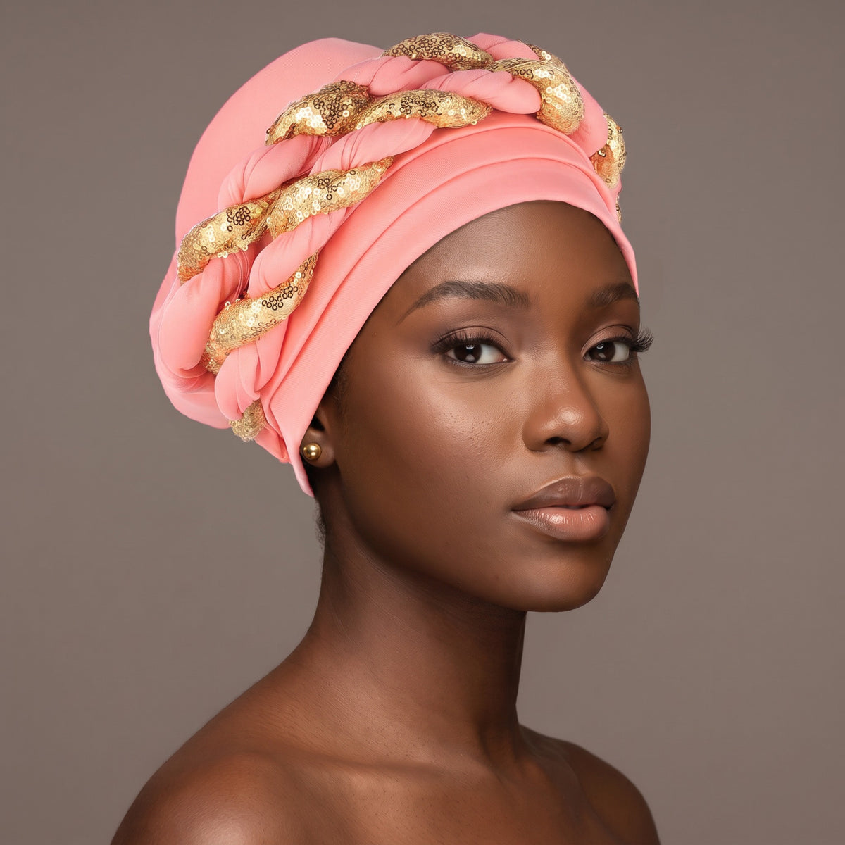 Woman wearing the pink sequin braided turban