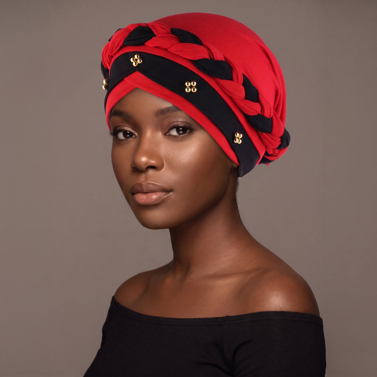 Woman wearing the red and black three-layer twist turban