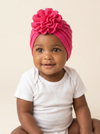 Baby girl wearing the hot pink flower turban cap