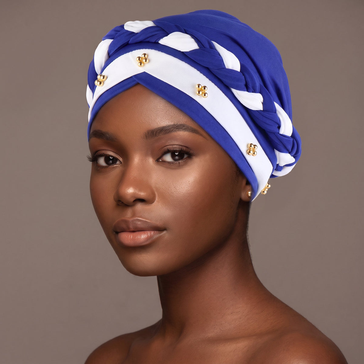 Woman wearing the sapphire and white three-layer twist turban