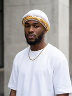 Man wearing the white halo turban with gold twist, urban portrait