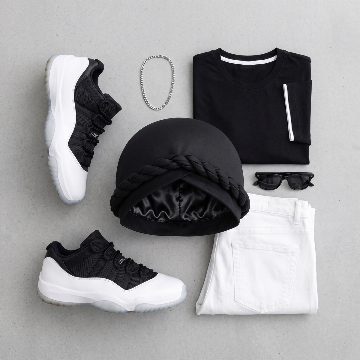 Flat-lay of the black halo turban with tee, sneakers and accessories