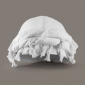 White cotton halo turban with tassel trim on a grey backdrop
